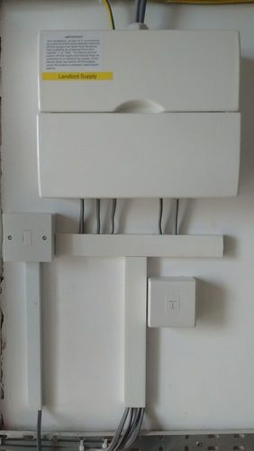 Landlords consumer unit with emergency light test switch.